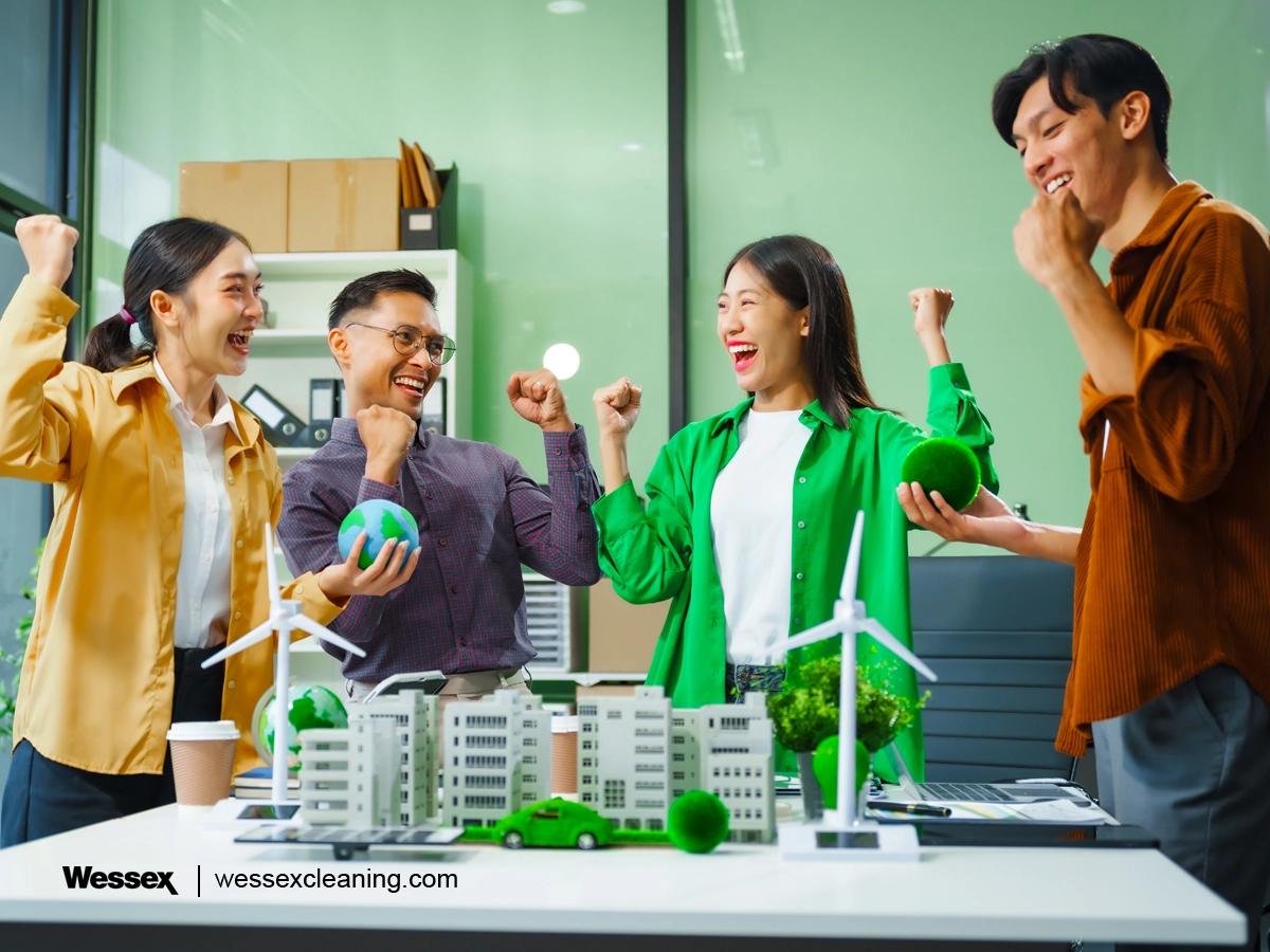 A happy business team standing next to an eco-friendly city scheme, highlighting how the UK Net Zero strategy benefits both businesses and the planet.