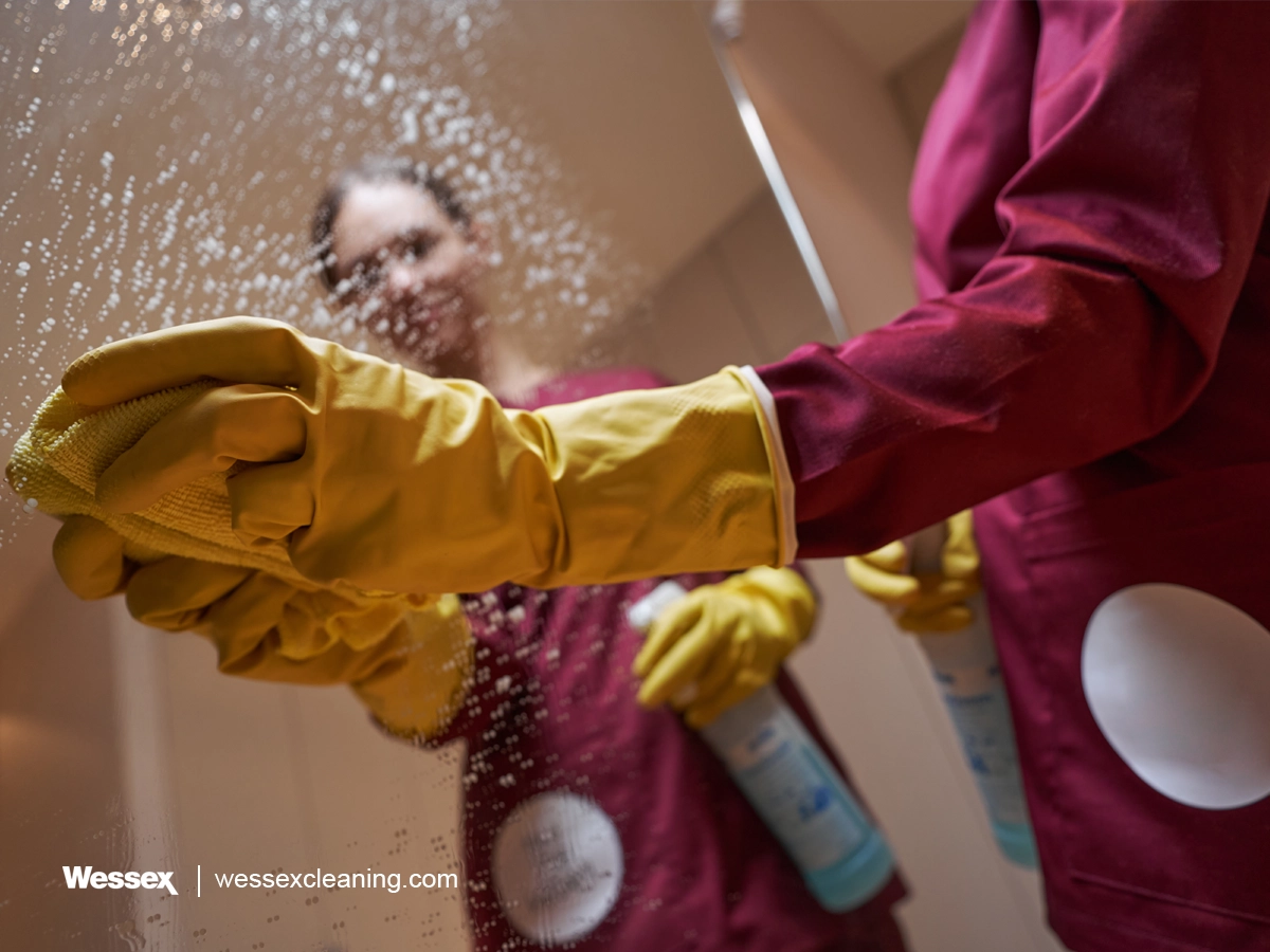 Janitor cleaning mirror with SAO, demonstrating its safety.