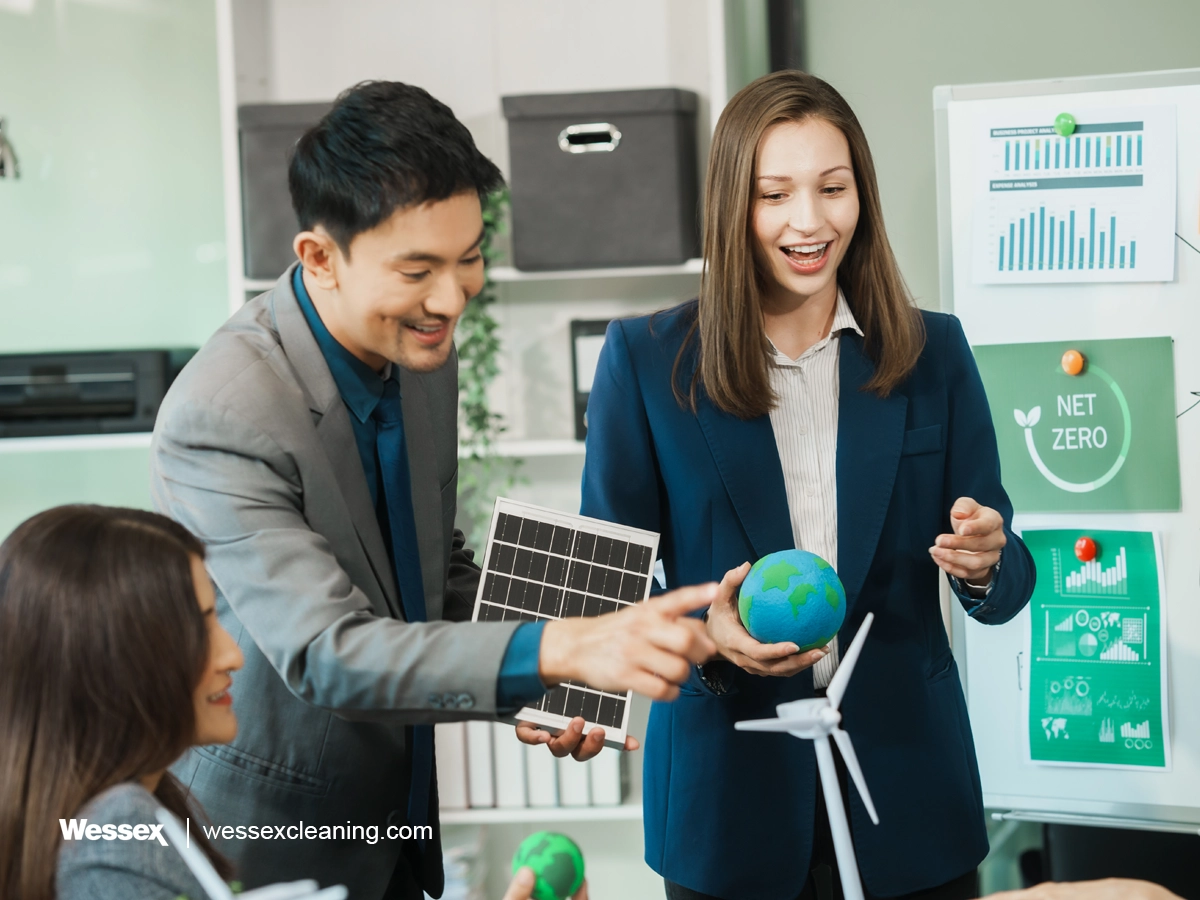 Business team having a discussion in a green office, focusing on reducing their carbon footprint and promoting sustainability.