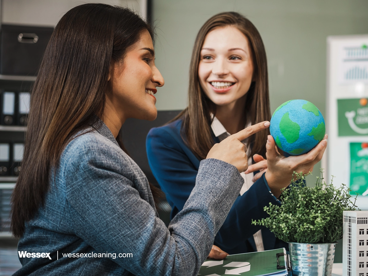 Businesswomen discussing effective ESG strategies for immediate impact in the workplace.