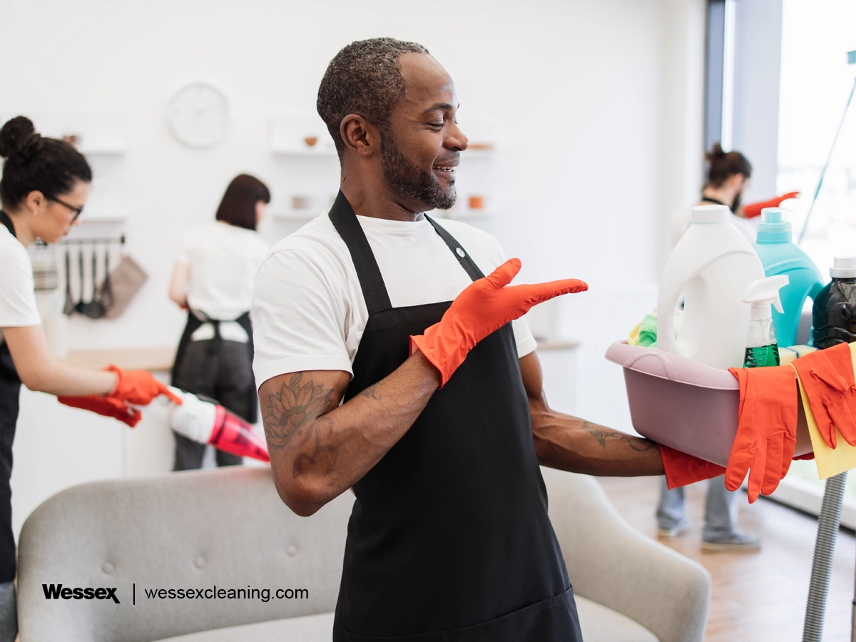 Cleaning worker pointing at eco-friendly cleaning products