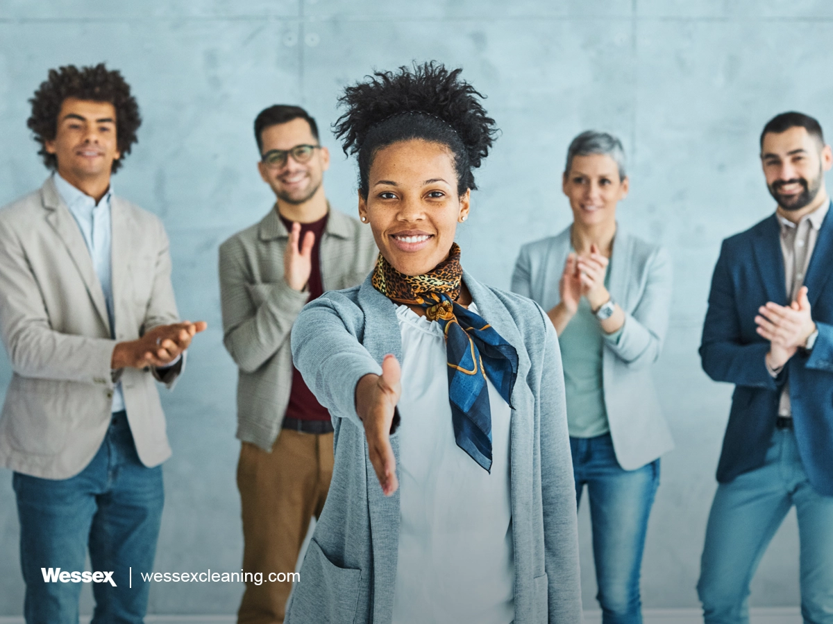 Young Business People Shaking Hands in Office Meeting