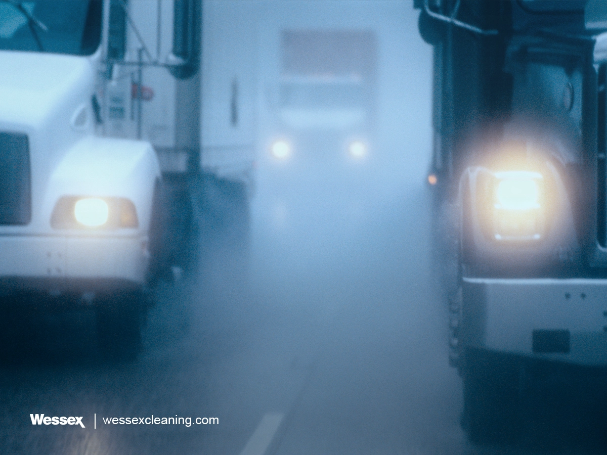 Partial view of a large commercial truck driving on the road