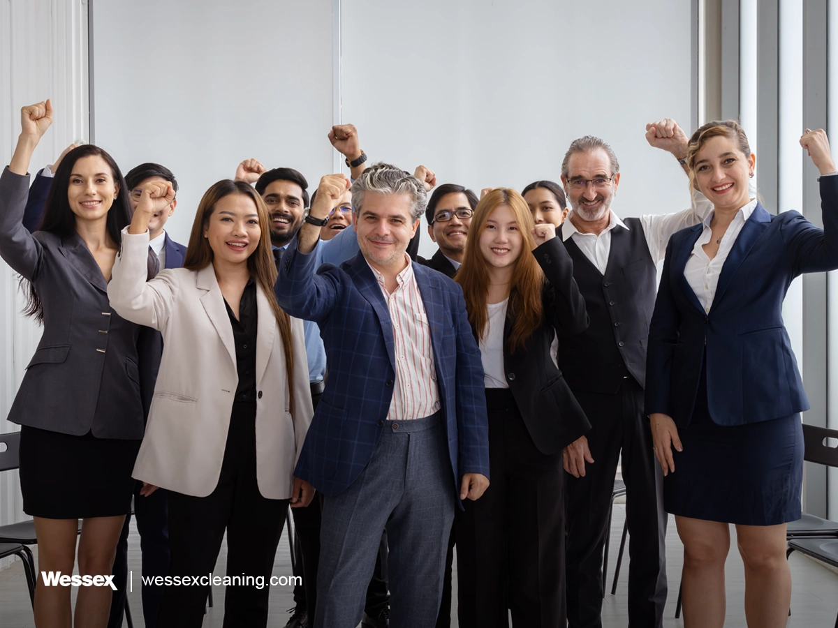 Group of happy businessmen smiling and discussing in office setting