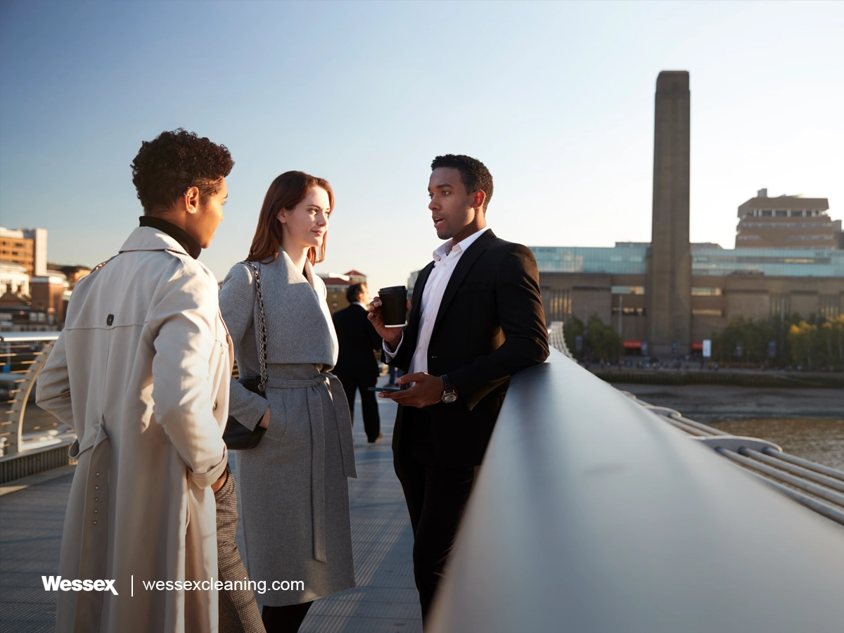 Three business colleagues talking on Millennium Bridge